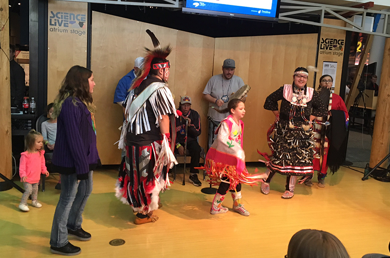 Science Fusion students dancing with Native American performers