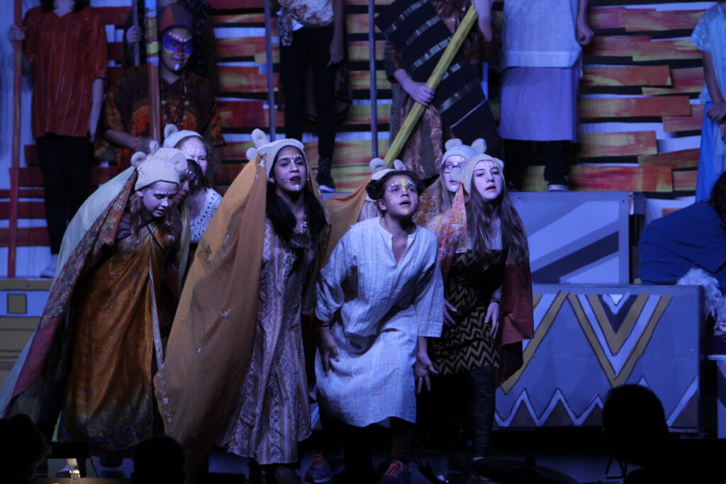 Students on stage for The Lion King Jr.