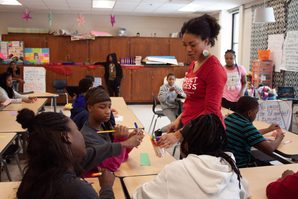 PS Facilitator working with students during a workshop in class