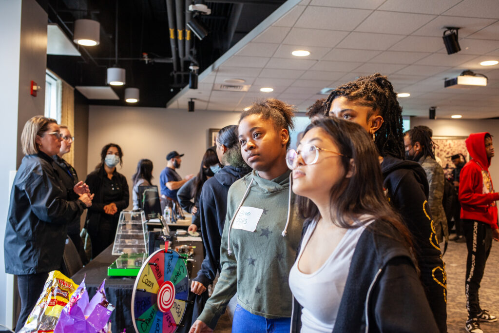 Students gathered together learning at MLK event at Science Museum.