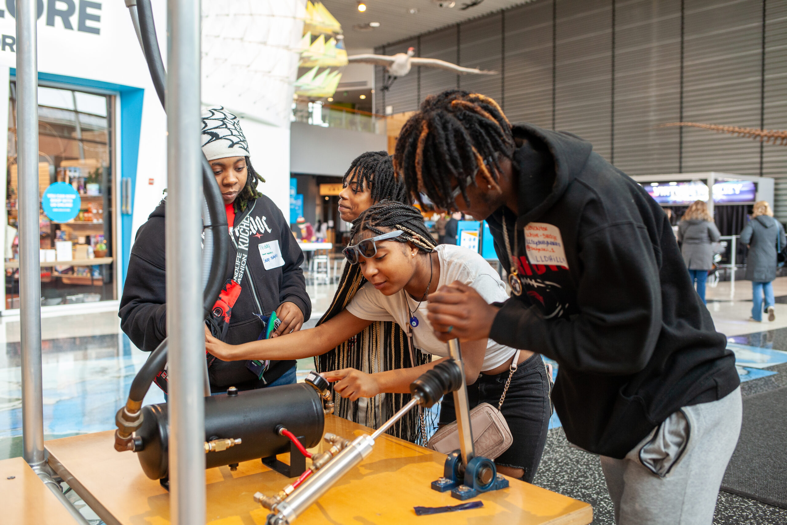 Students gathered together learning at MLK event at Science Museum.