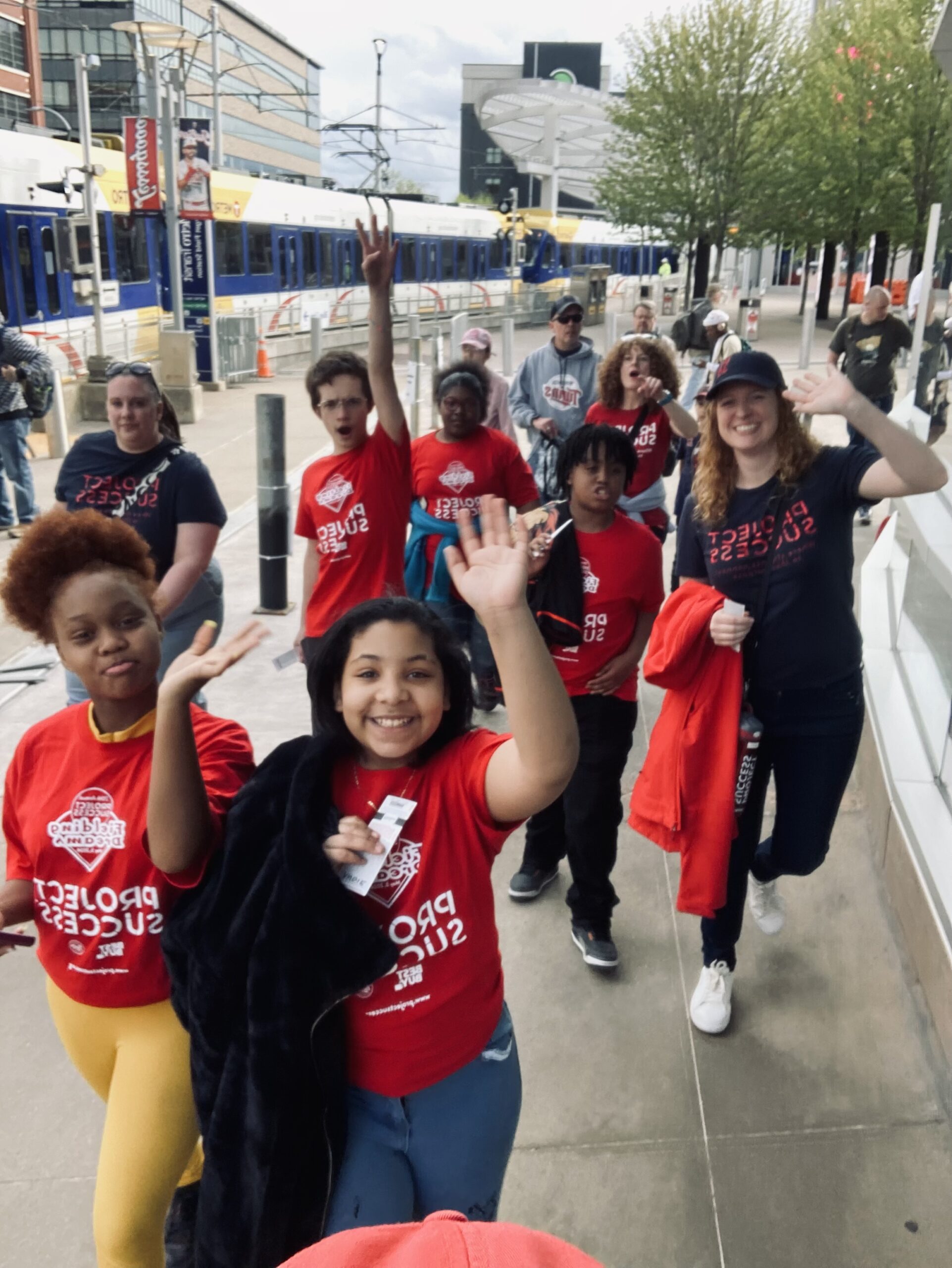 Students heading to sing on the field.