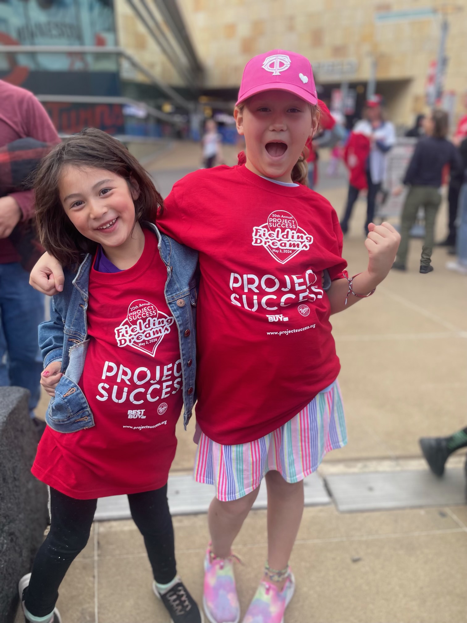 Two students in Fielding Dreams t-shirts.