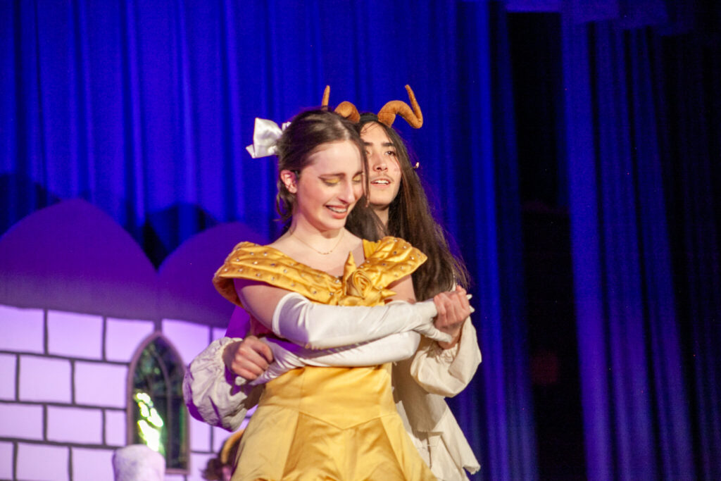 PS students on stage for Beauty and the Beast