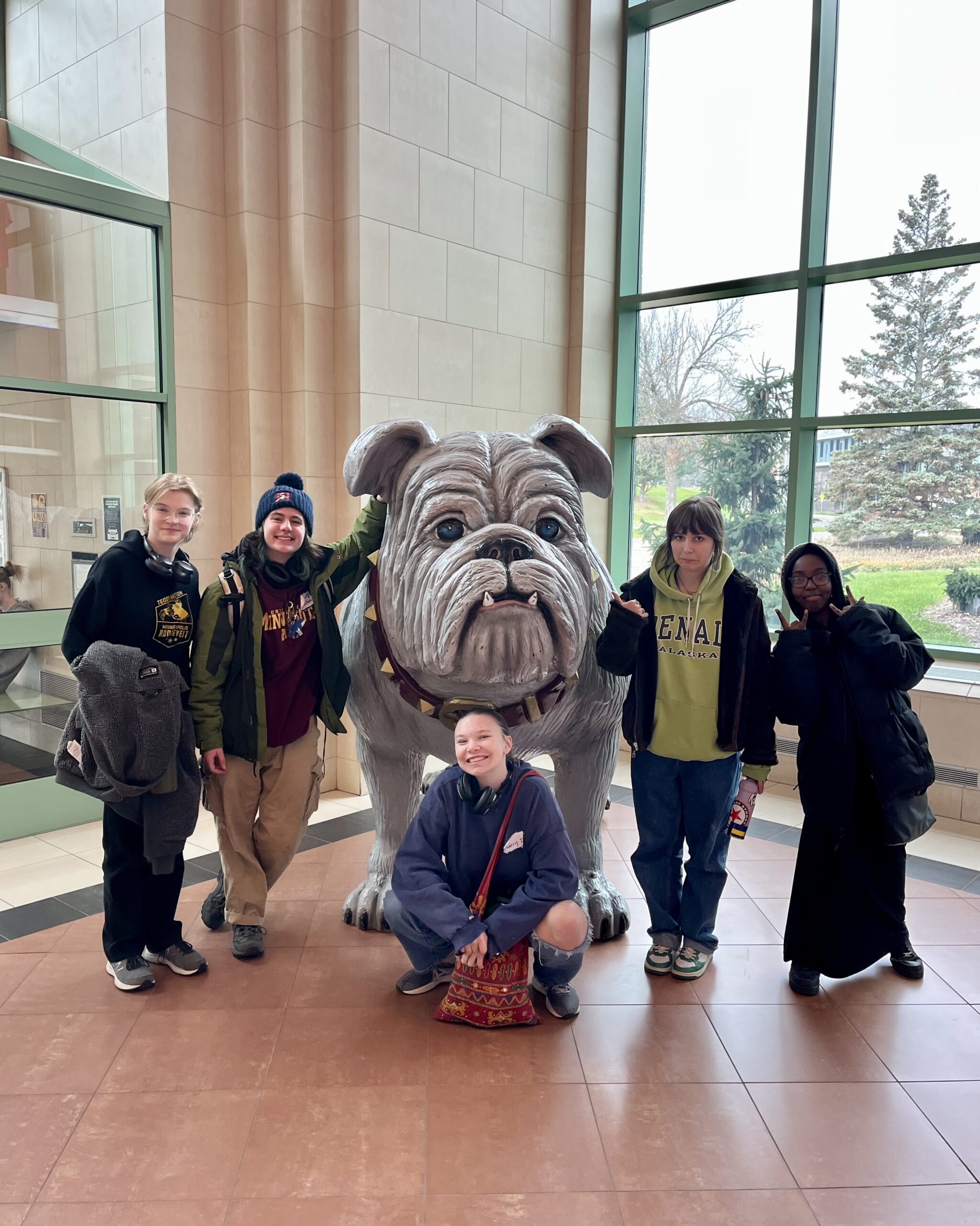 PS students pose with a statue of UMD's bulldog mascot