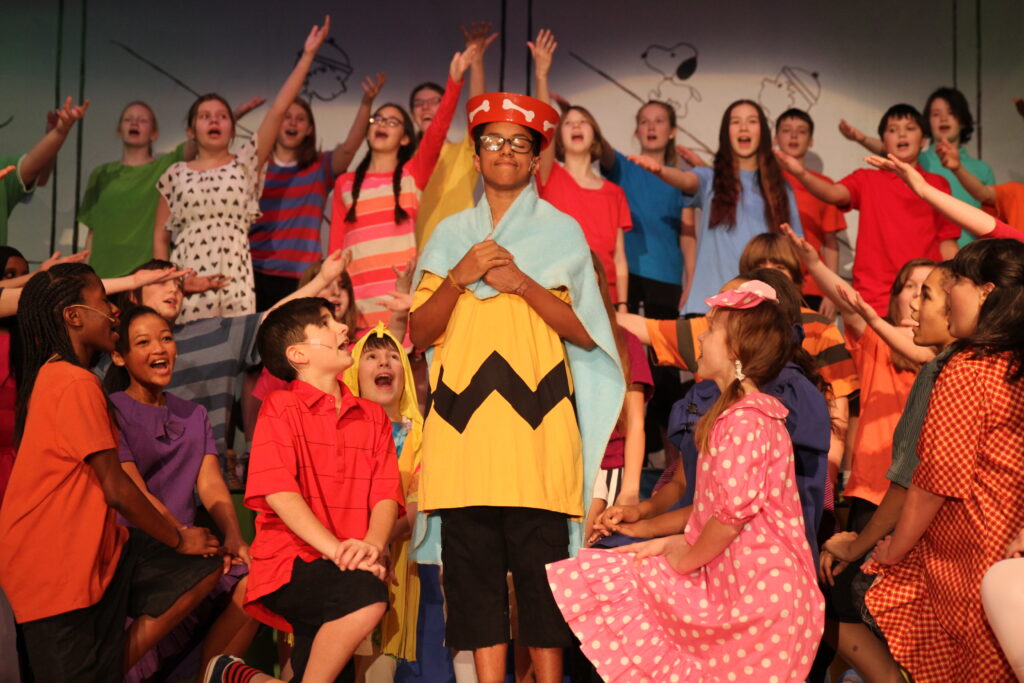 PS students on stage for Charlie Brown