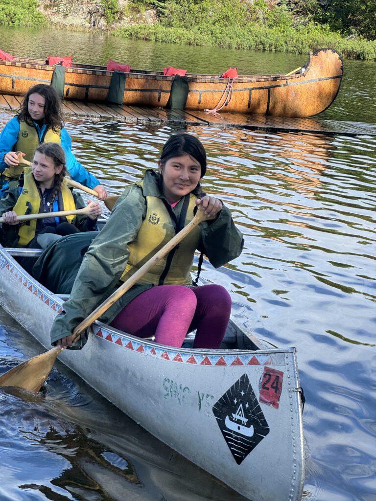 A group of students in a canoe.