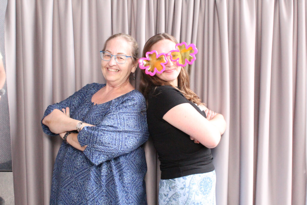 Two Project Success partner teachers and staff in the photo booth.