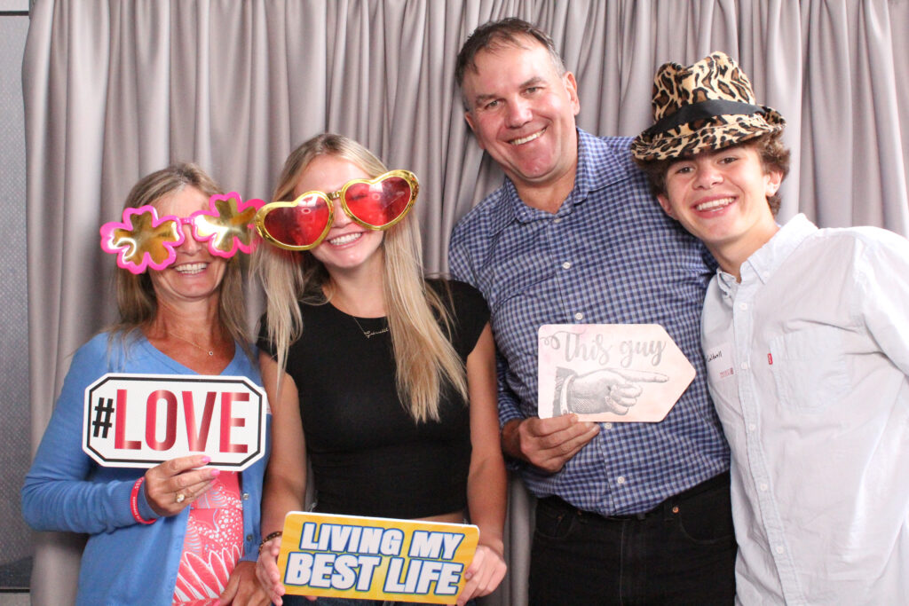 Four Project Success partner teachers and staff in the photo booth.